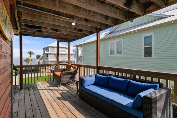 a view of a two chairs in the balcony