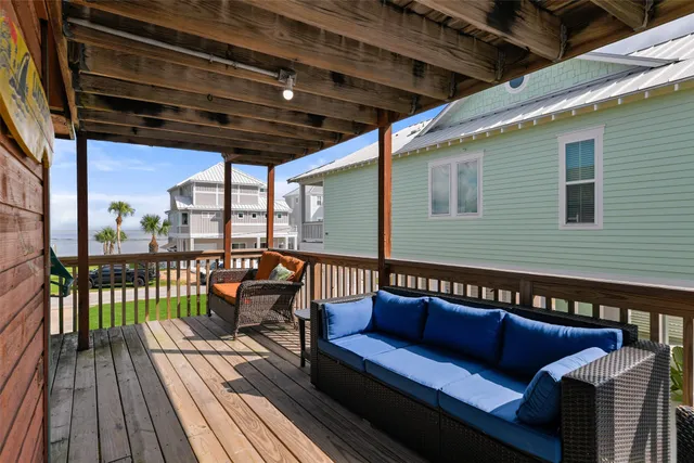 a view of a two chairs in the balcony