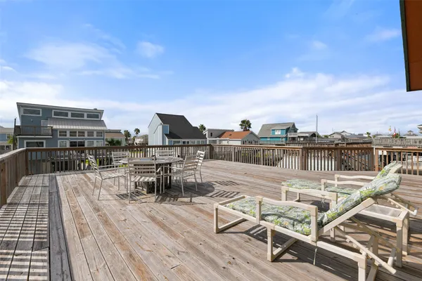 a view of a roof deck with patio