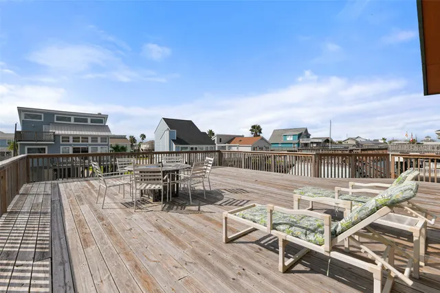 a view of a roof deck with patio