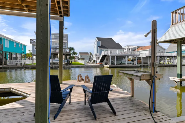 a view of a lake with a table and chairs