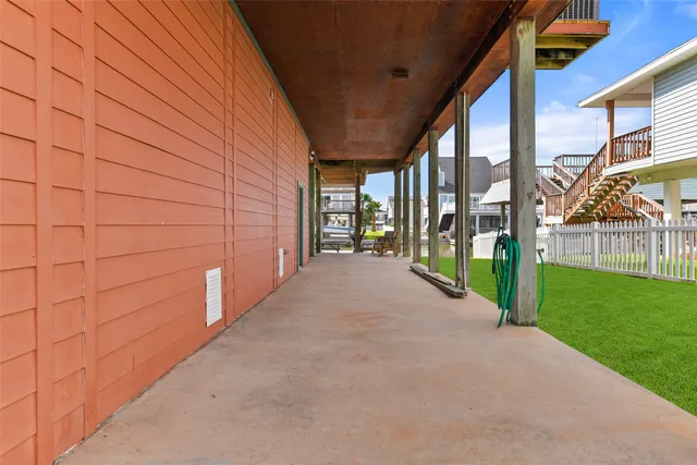 a view of a pathway both side of house