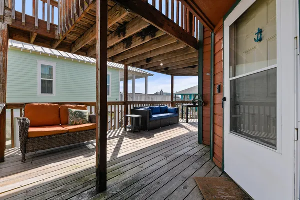a view of a balcony with furniture