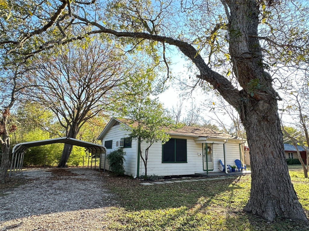 601 Elm Street Bastrop, TX 78602 - Photo 1 of 1 a view of a house with a large tree