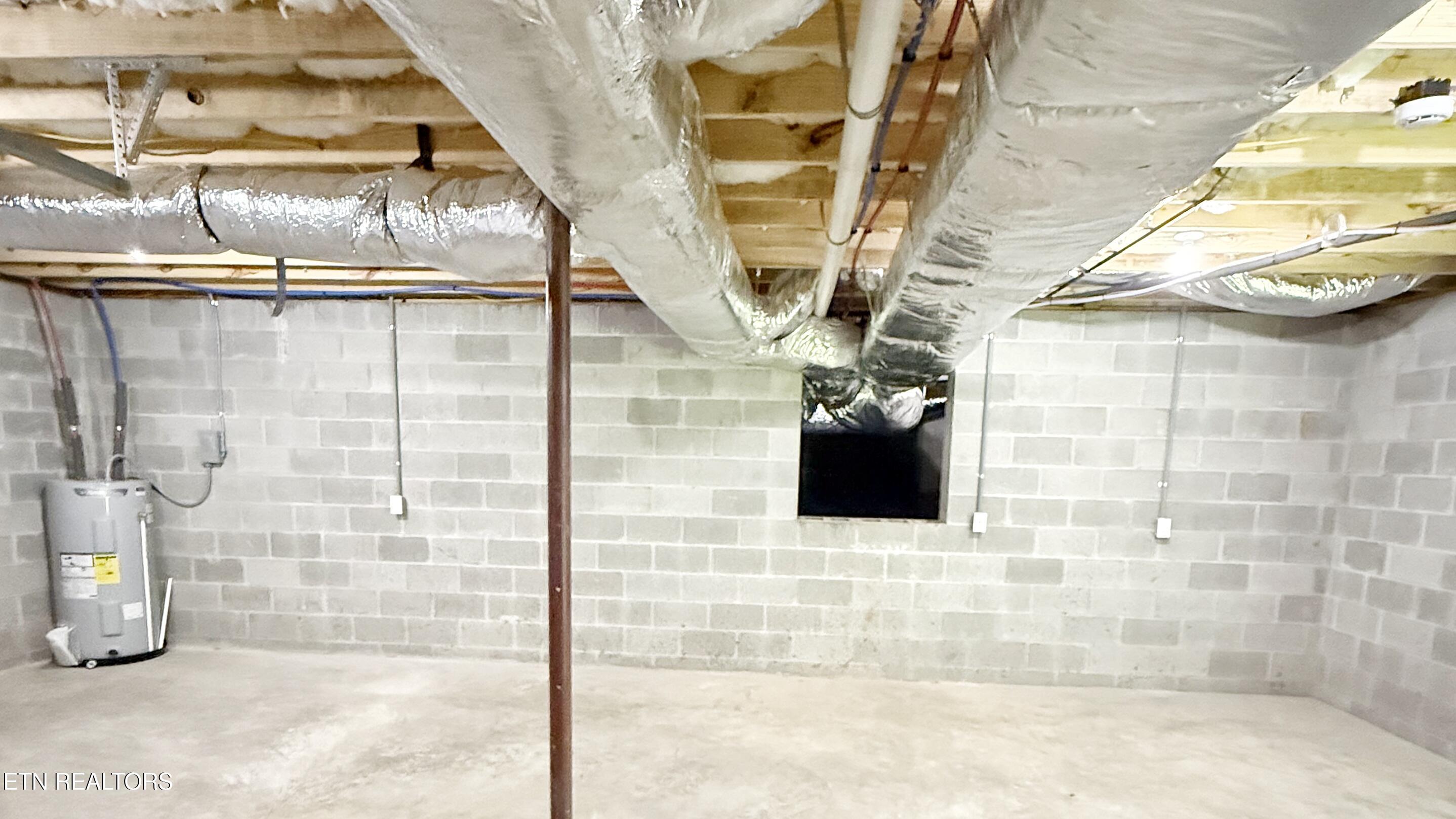 236 Meadowood Road Newport, TN 37821 - Photo 40 of 42 UNFINISHED BASEMENT STORAGE WORKSHOP