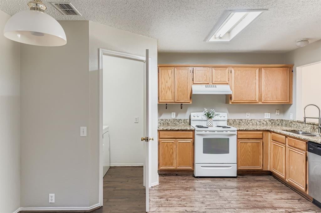 8532 Tallahassee Lane Fort Worth, TX 76123 - Photo 14 of 29 a kitchen with a sink and cabinets