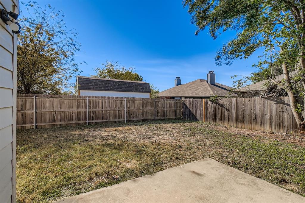 8532 Tallahassee Lane Fort Worth, TX 76123 - Photo 27 of 29 a backyard of a house with lots of green space