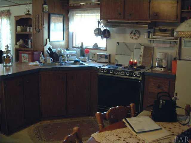 6415 Mary Kitchens Road Milton, FL 32583 - Photo 6 of 6 Eat-In kitchen of Mobile Home with breadfast bar.