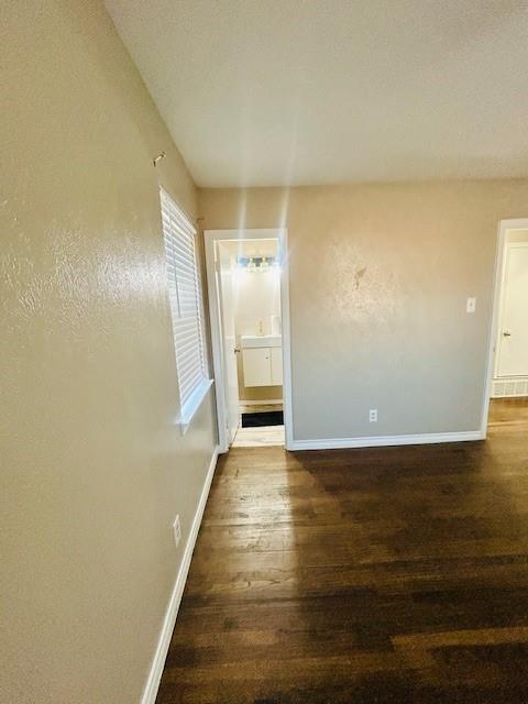 527 Aspen Street Lancaster, TX 75134 - Photo 11 of 18 a view of a hallway with wooden floor