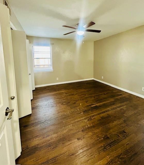527 Aspen Street Lancaster, TX 75134 - Photo 8 of 18 wooden floor in an empty room with a window