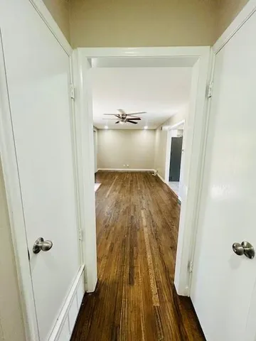 a view of a hardwood floor in a bathroom