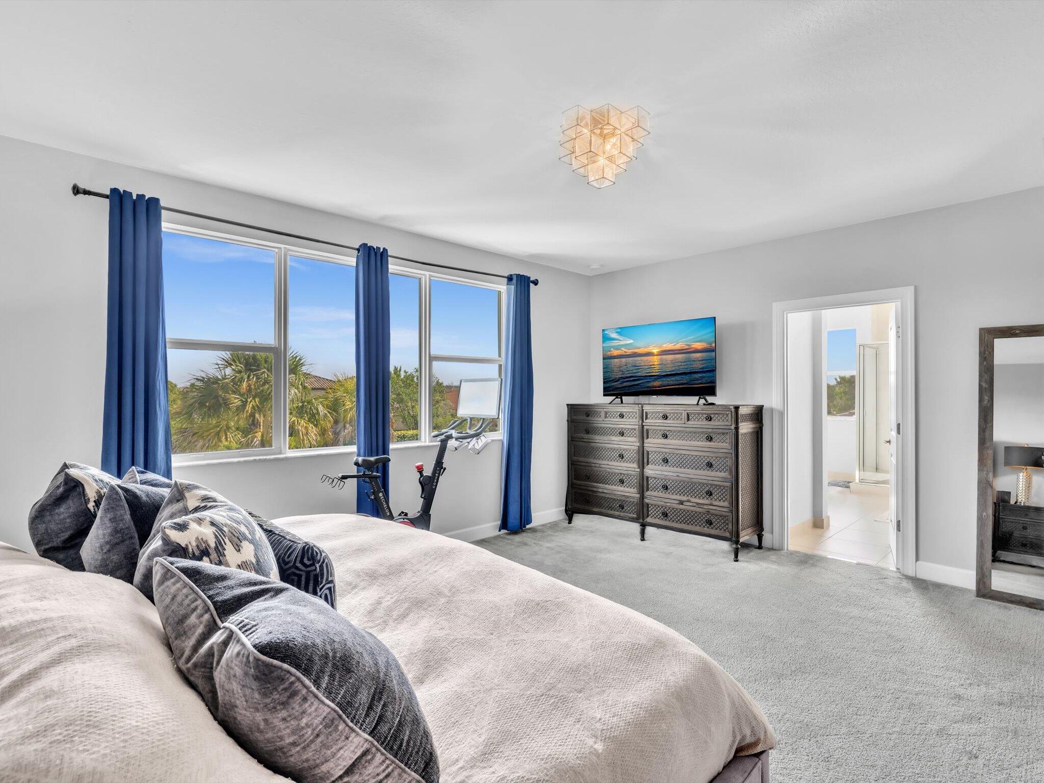 4708 Saddle Ranch Road Lake Worth, FL 33467 - Photo 24 of 45 a bed sitting in a bedroom next to a window