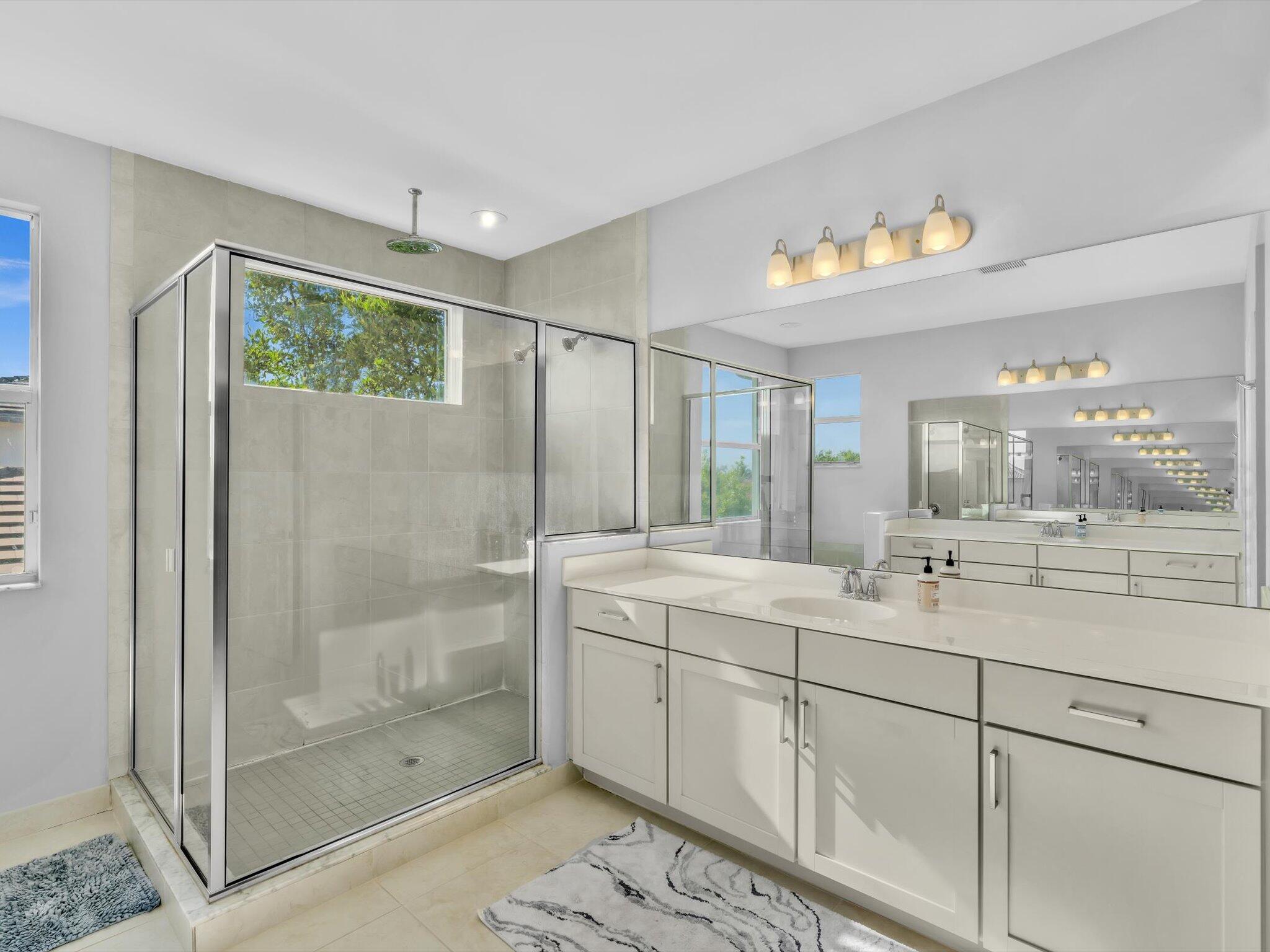 4708 Saddle Ranch Road Lake Worth, FL 33467 - Photo 28 of 45 a bathroom with a shower sink and mirror