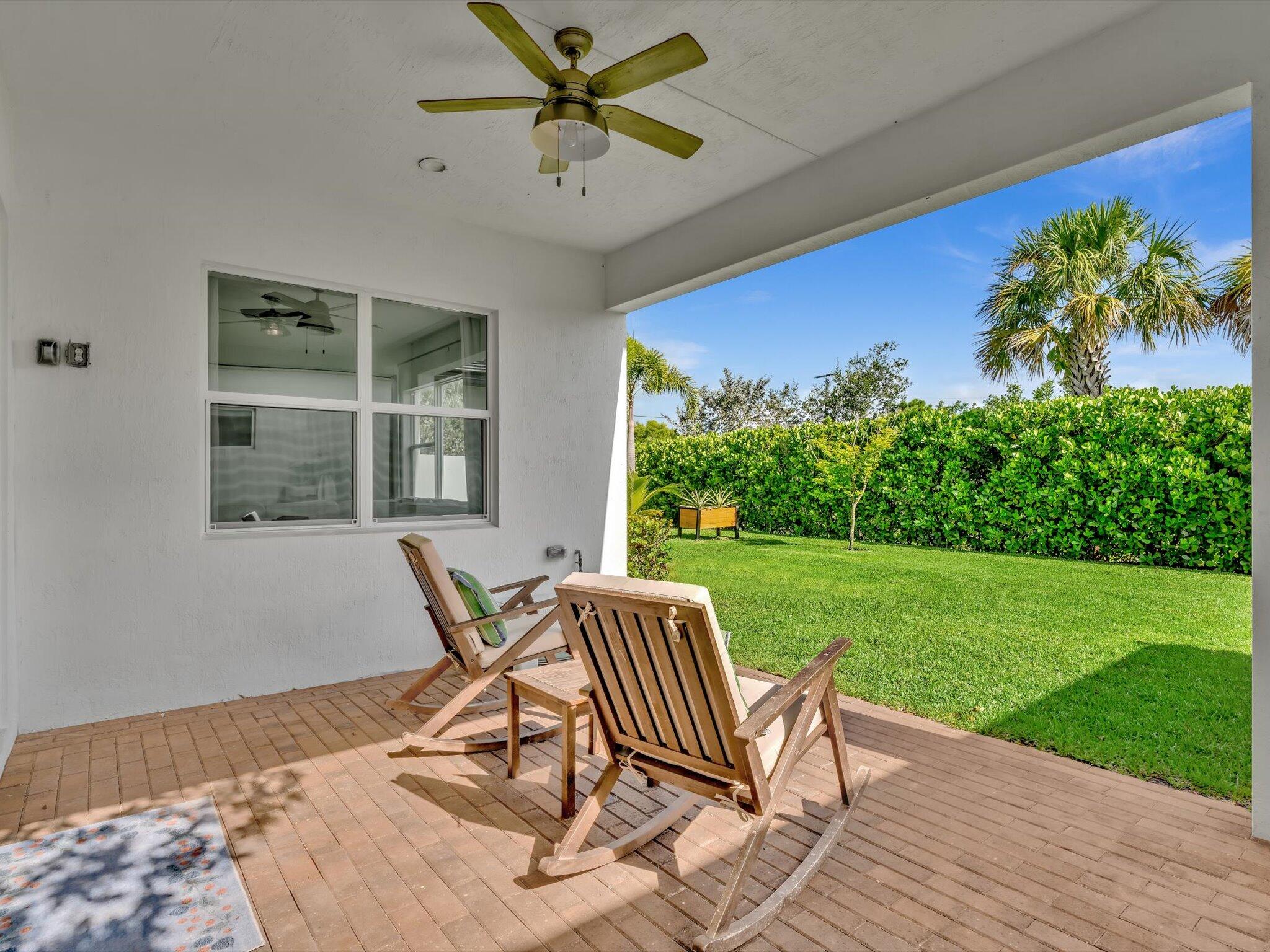 4708 Saddle Ranch Road Lake Worth, FL 33467 - Photo 30 of 45 a view of a house with backyard porch and sitting area