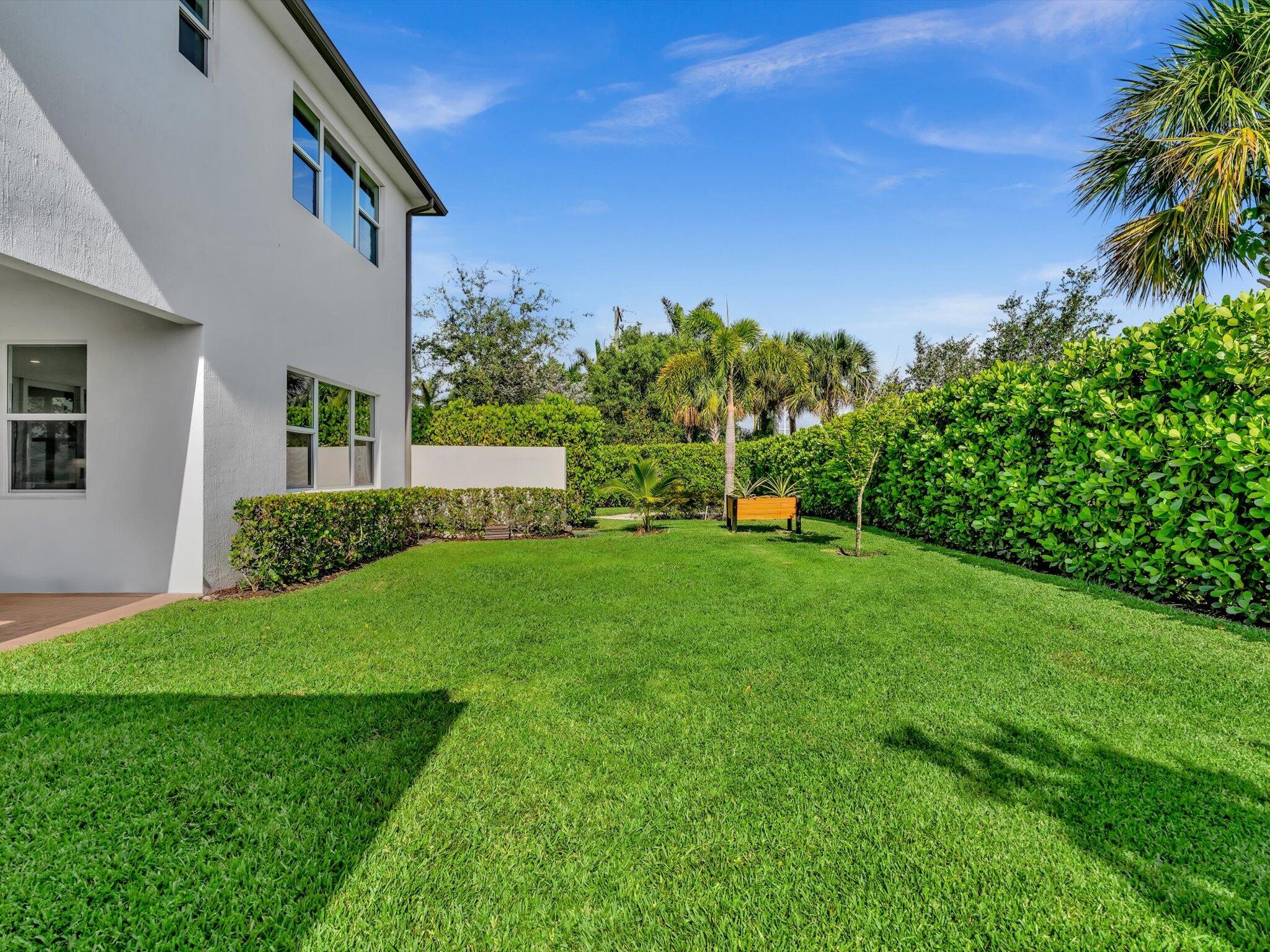 4708 Saddle Ranch Road Lake Worth, FL 33467 - Photo 32 of 45 a view of a house with a yard