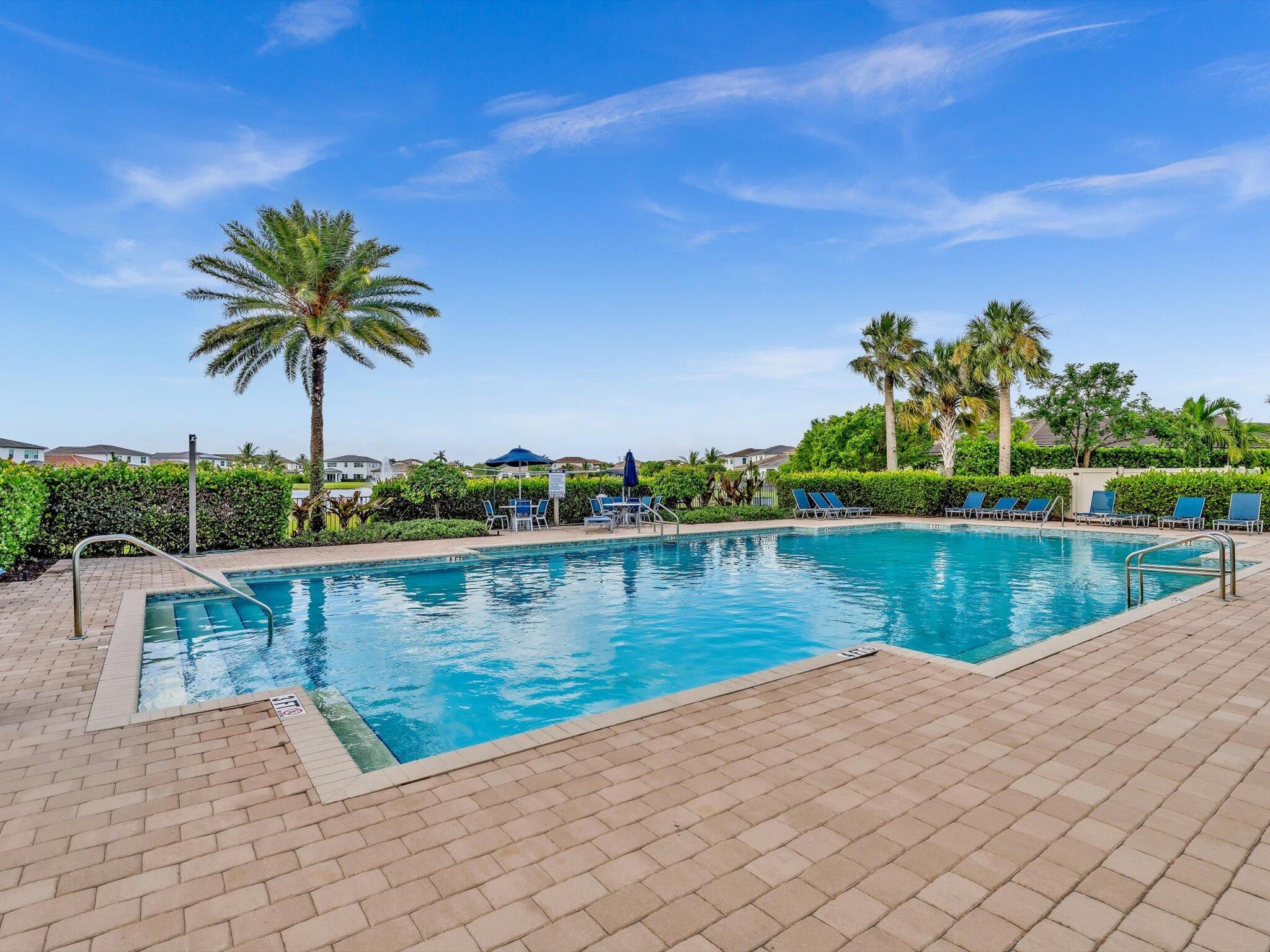 4708 Saddle Ranch Road Lake Worth, FL 33467 - Photo 39 of 45 a view of a lake with a house in the background