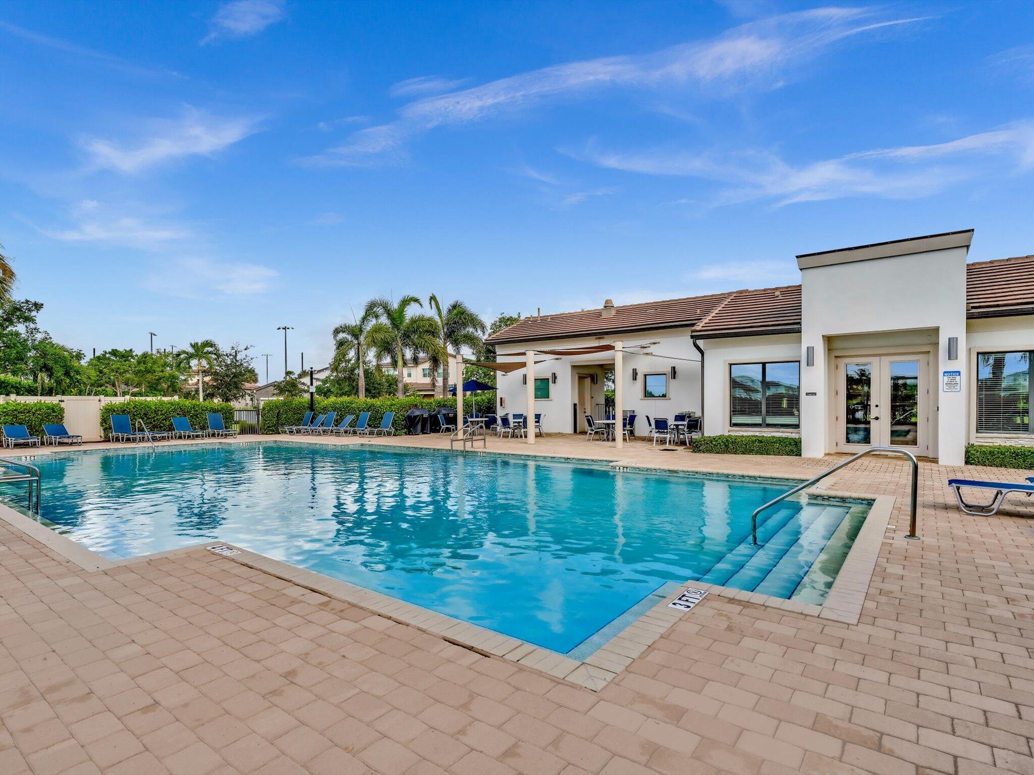 4708 Saddle Ranch Road Lake Worth, FL 33467 - Photo 40 of 45 a front view of a house with a lake view