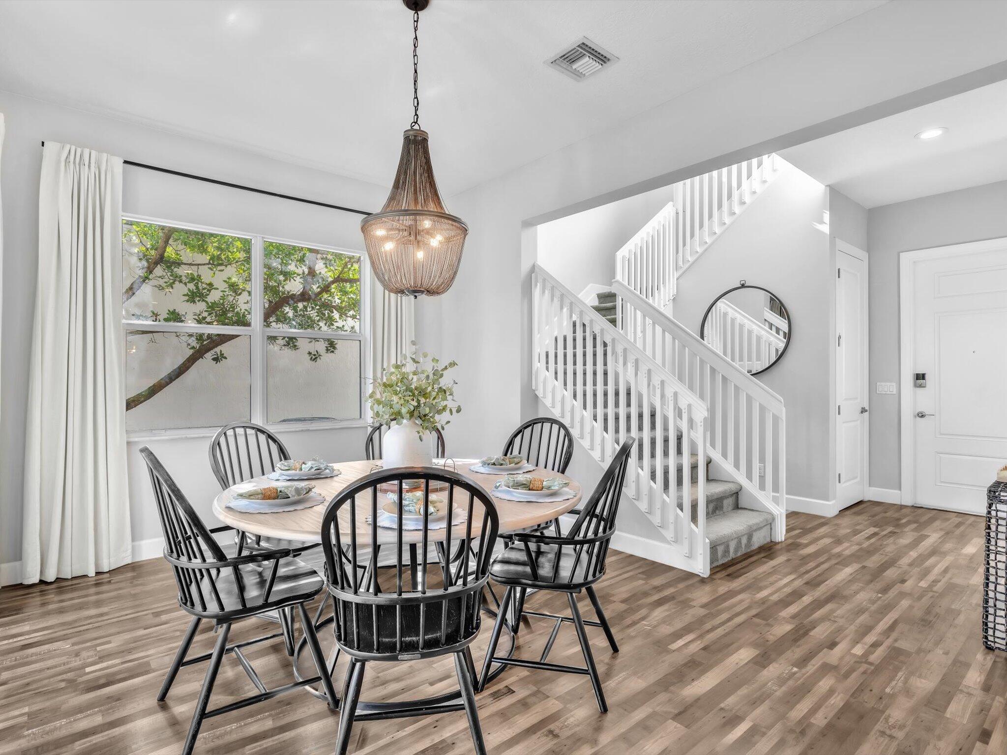 4708 Saddle Ranch Road Lake Worth, FL 33467 - Photo 5 of 45 a view of a dining room with furniture window and wooden floor