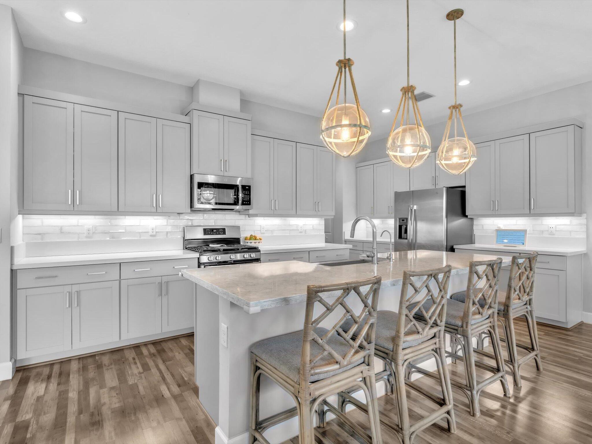 4708 Saddle Ranch Road Lake Worth, FL 33467 - Photo 7 of 45 a kitchen with cabinets a sink and appliances