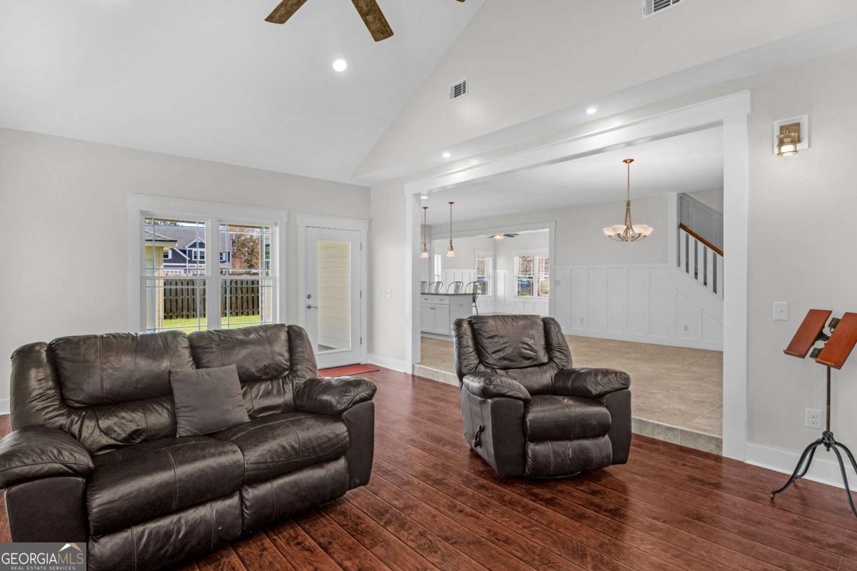 328 Windsor Road Guyton, GA 31312 - Photo 13 of 39 a living room with furniture and a flat screen tv