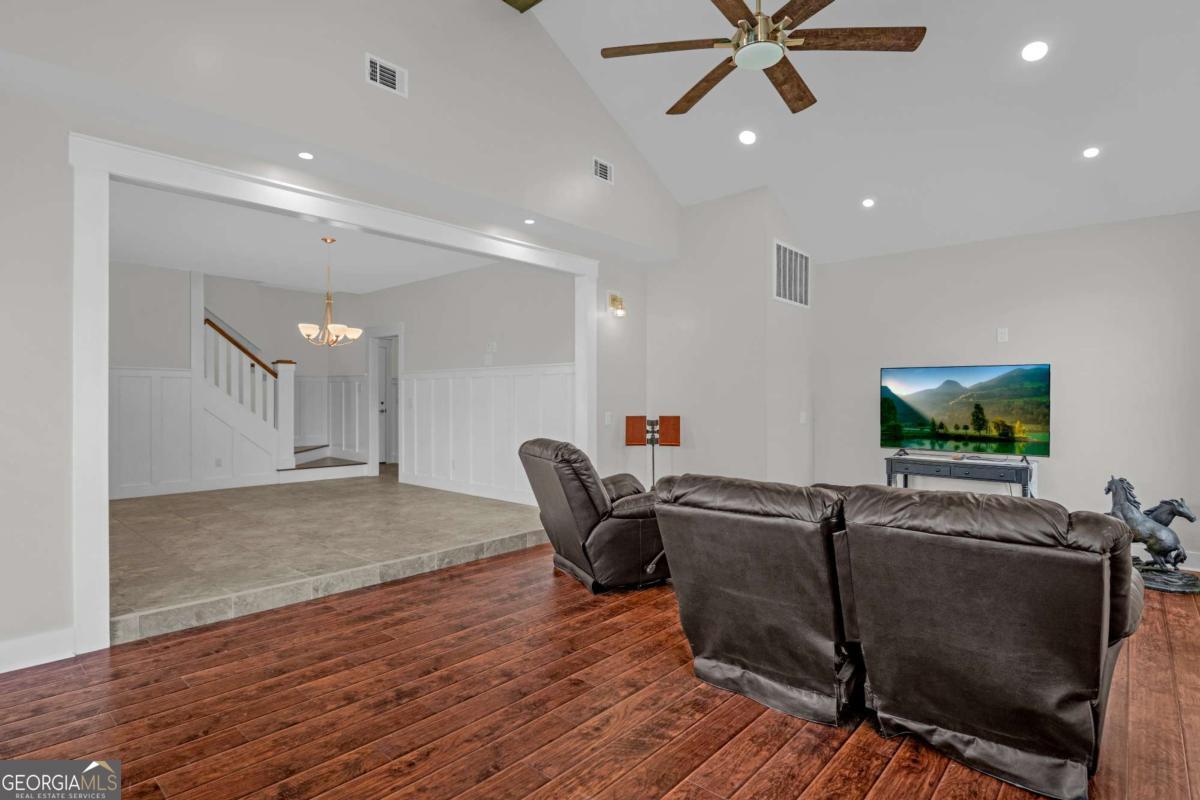328 Windsor Road Guyton, GA 31312 - Photo 14 of 39 a living room with furniture and a flat screen tv