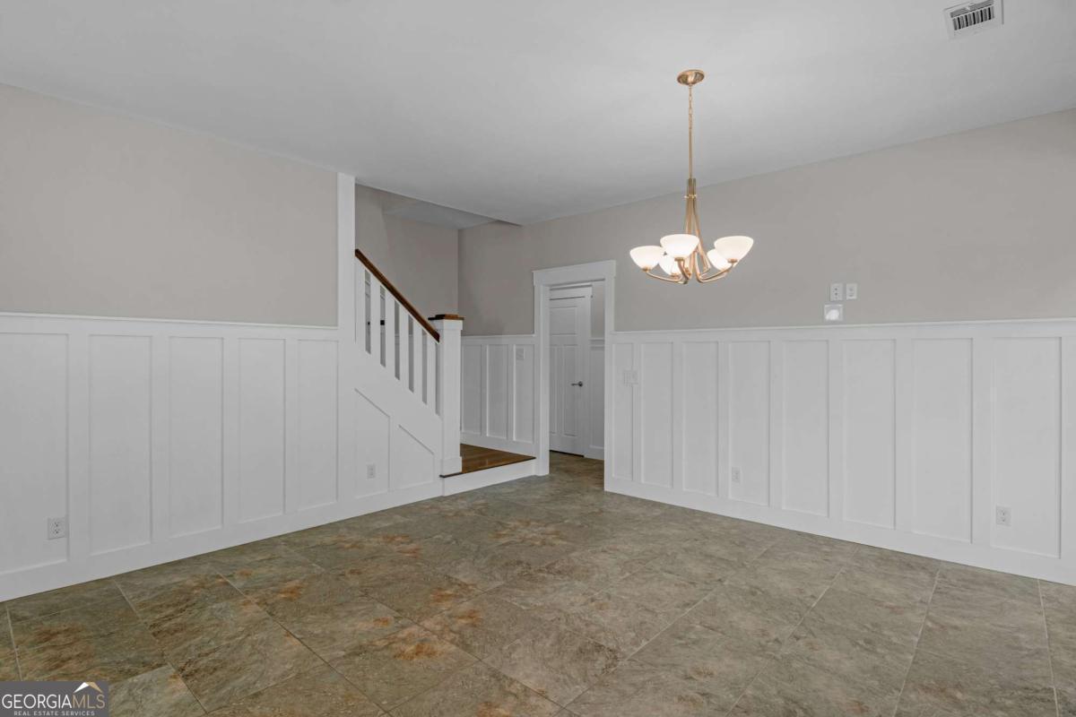 328 Windsor Road Guyton, GA 31312 - Photo 17 of 39 a view of a chandelier fan and entryway in a room