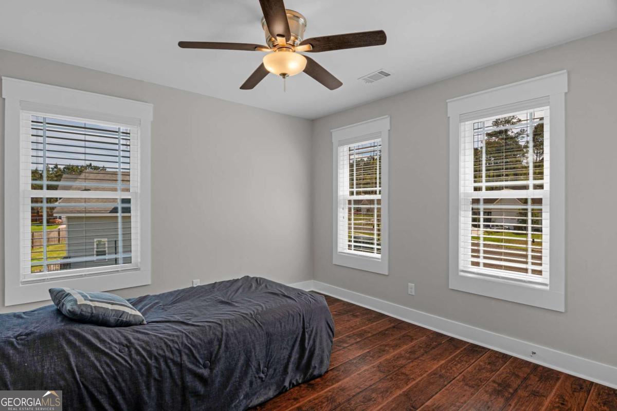 328 Windsor Road Guyton, GA 31312 - Photo 27 of 39 a bedroom with a bed and a window