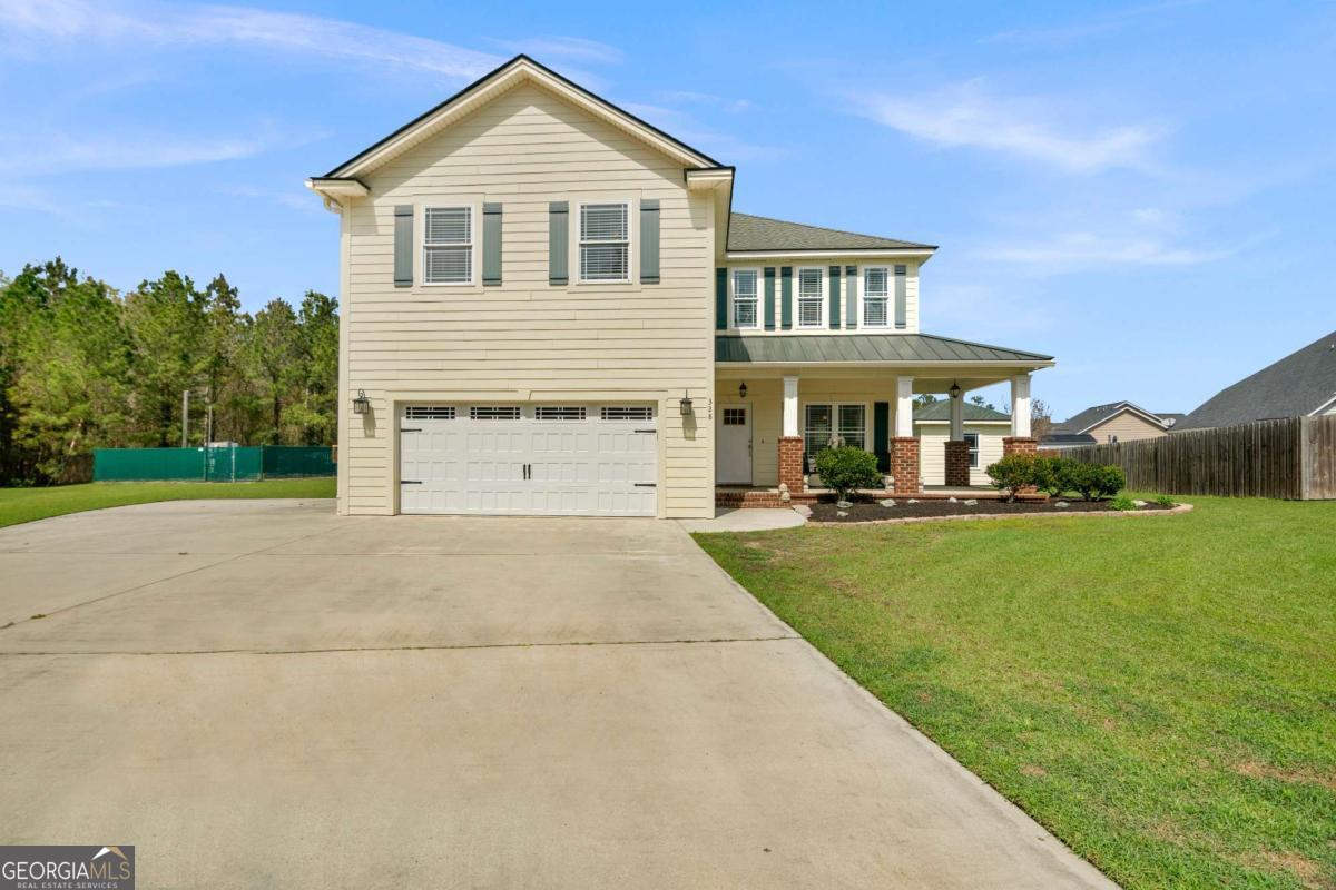 328 Windsor Road Guyton, GA 31312 - Photo 3 of 39 a view of a house with a yard