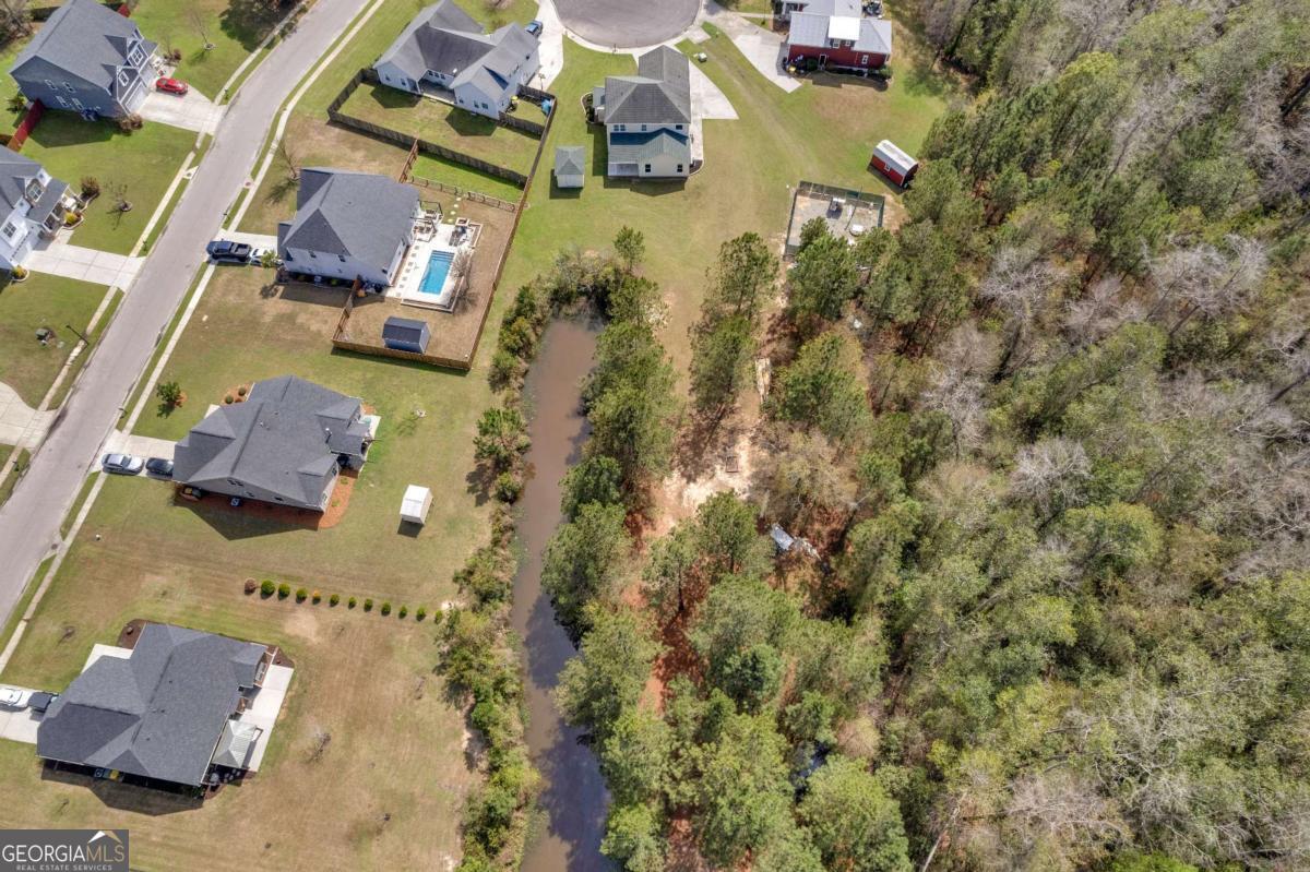 328 Windsor Road Guyton, GA 31312 - Photo 35 of 39 an aerial view of residential houses with outdoor space