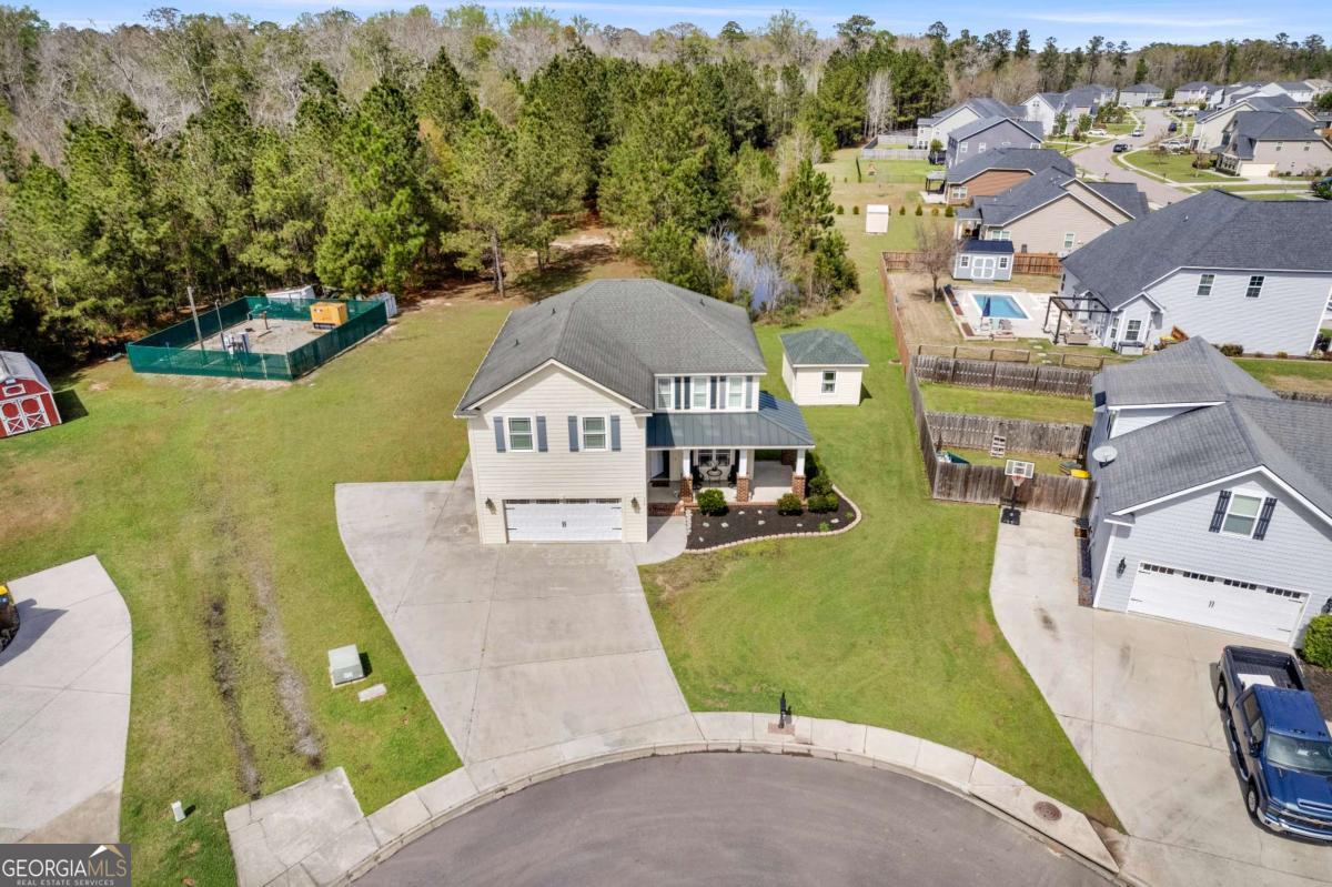 328 Windsor Road Guyton, GA 31312 - Photo 38 of 39 an aerial view of a house with a garden