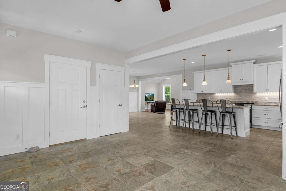 328 Windsor Road Guyton, GA 31312 - Photo 4 of 39 a view of kitchen with furniture and refrigerator