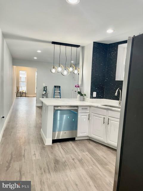 1812 North Smallwood Street Baltimore, MD 21216 - Photo 16 of 21 a bathroom with a sink a counter a toilet and a mirror