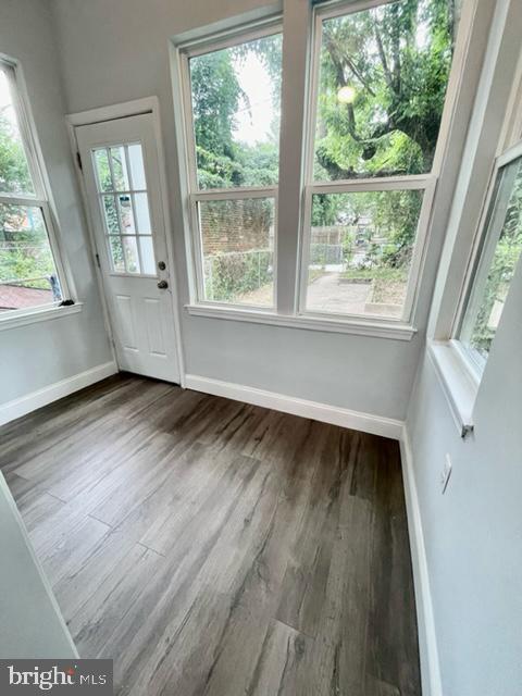 1812 North Smallwood Street Baltimore, MD 21216 - Photo 19 of 21 an empty room with wooden floor and windows