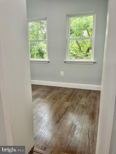 1812 North Smallwood Street Baltimore, MD 21216 - Photo 4 of 21 an empty room with wooden floor and windows