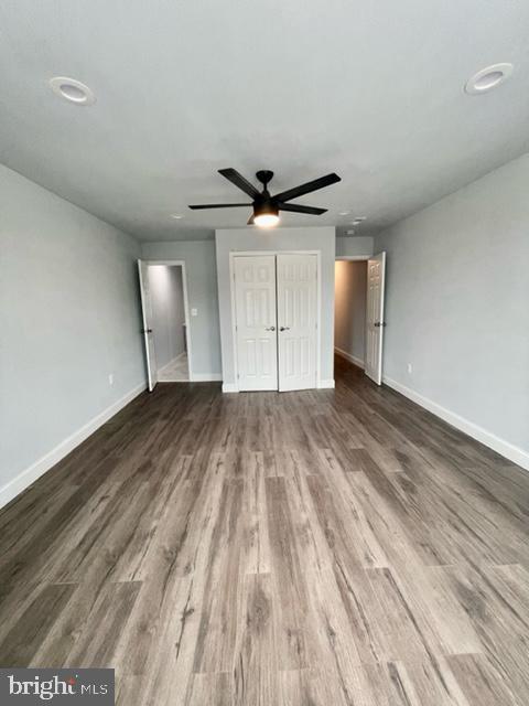 1812 North Smallwood Street Baltimore, MD 21216 - Photo 10 of 21 an empty room with wooden floor and a ceiling fan