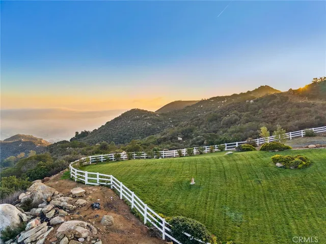 a view of a town with mountains in the background
