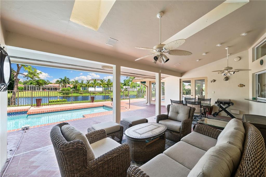 547 Devils Lane Naples, FL 34103 - Photo 5 of 13 a living room with furniture and a large window