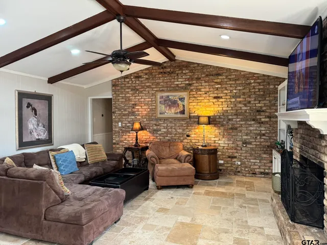 a living room with furniture and a fireplace