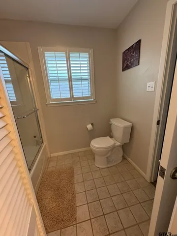 a bathroom with a toilet