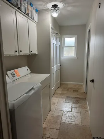 a view of storage and utility room with a washer and dryer