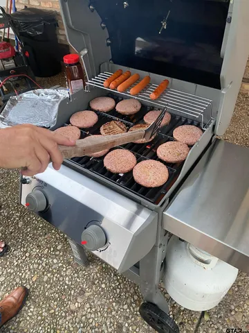 a table chair and a stove sitting inside of the room