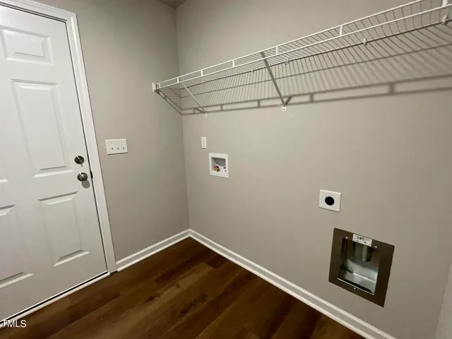 a view of a room with wooden floor and closet