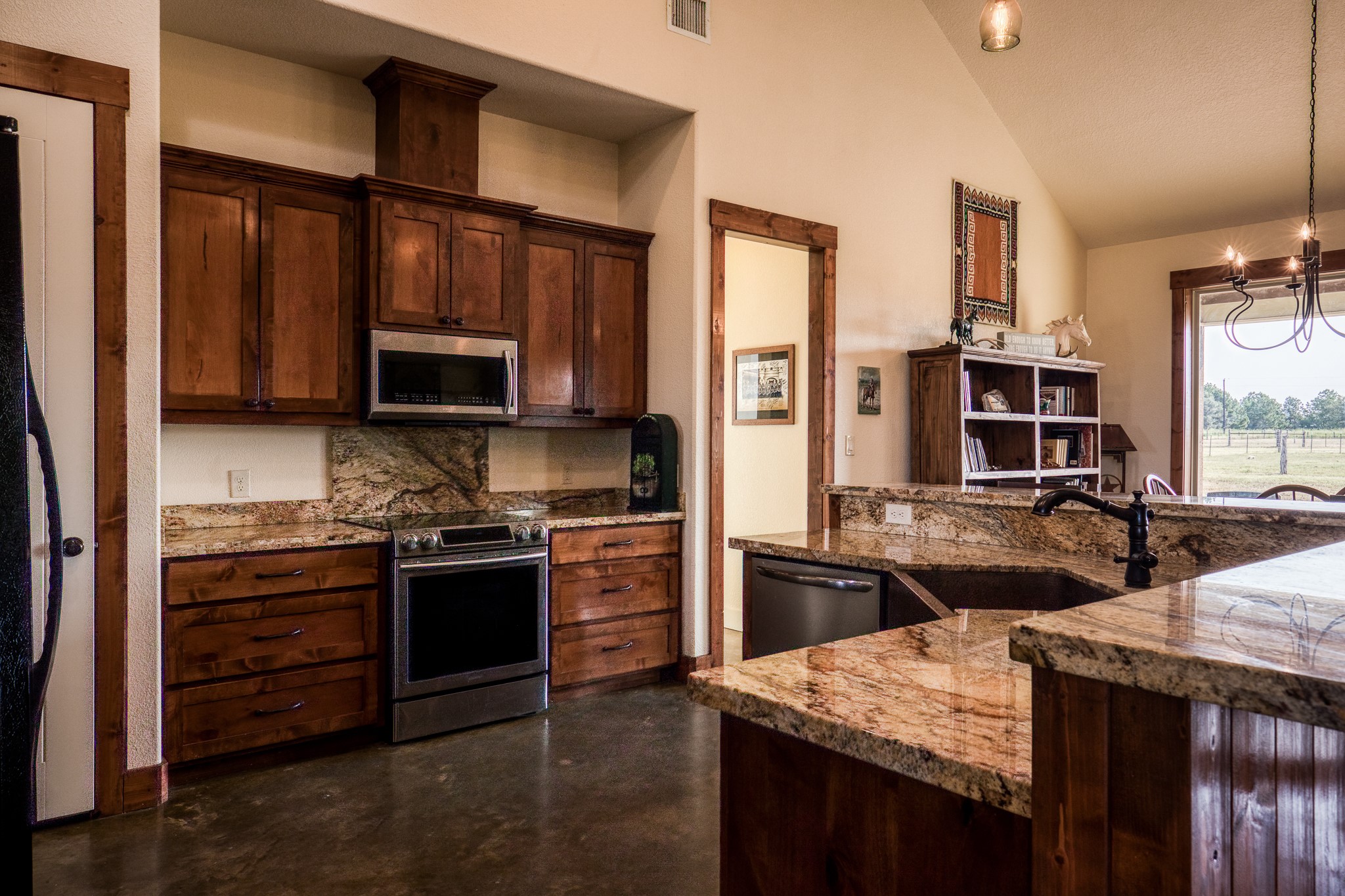 8201 Lone Star Road Washington, TX 77880 - Photo 13 of 22 a kitchen with stainless steel appliances granite countertop a stove top oven a sink and dishwasher