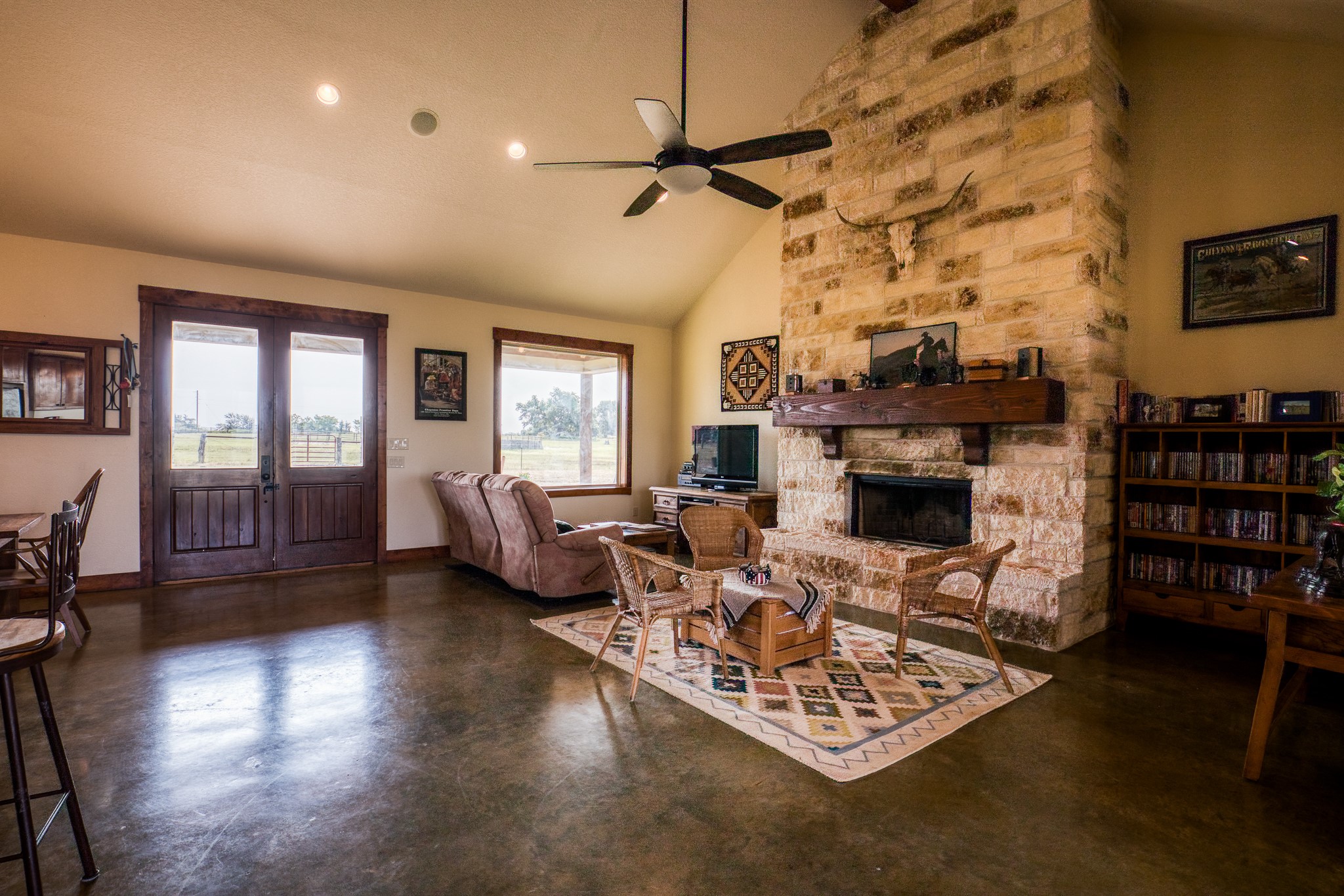 8201 Lone Star Road Washington, TX 77880 - Photo 7 of 22 a living room with furniture a fireplace and a flat screen tv