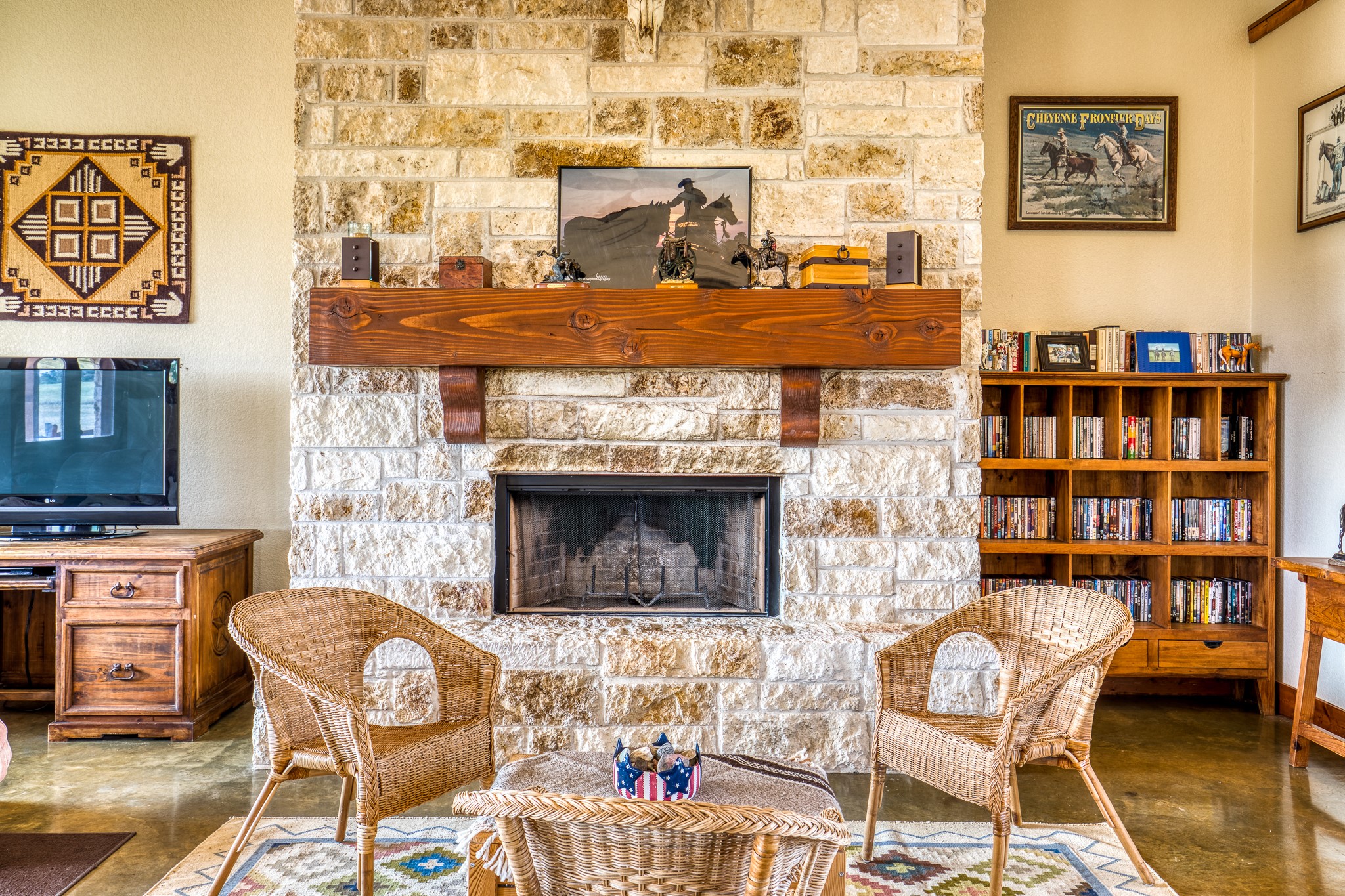 8201 Lone Star Road Washington, TX 77880 - Photo 9 of 22 a living room with furniture a flat screen tv and a fireplace