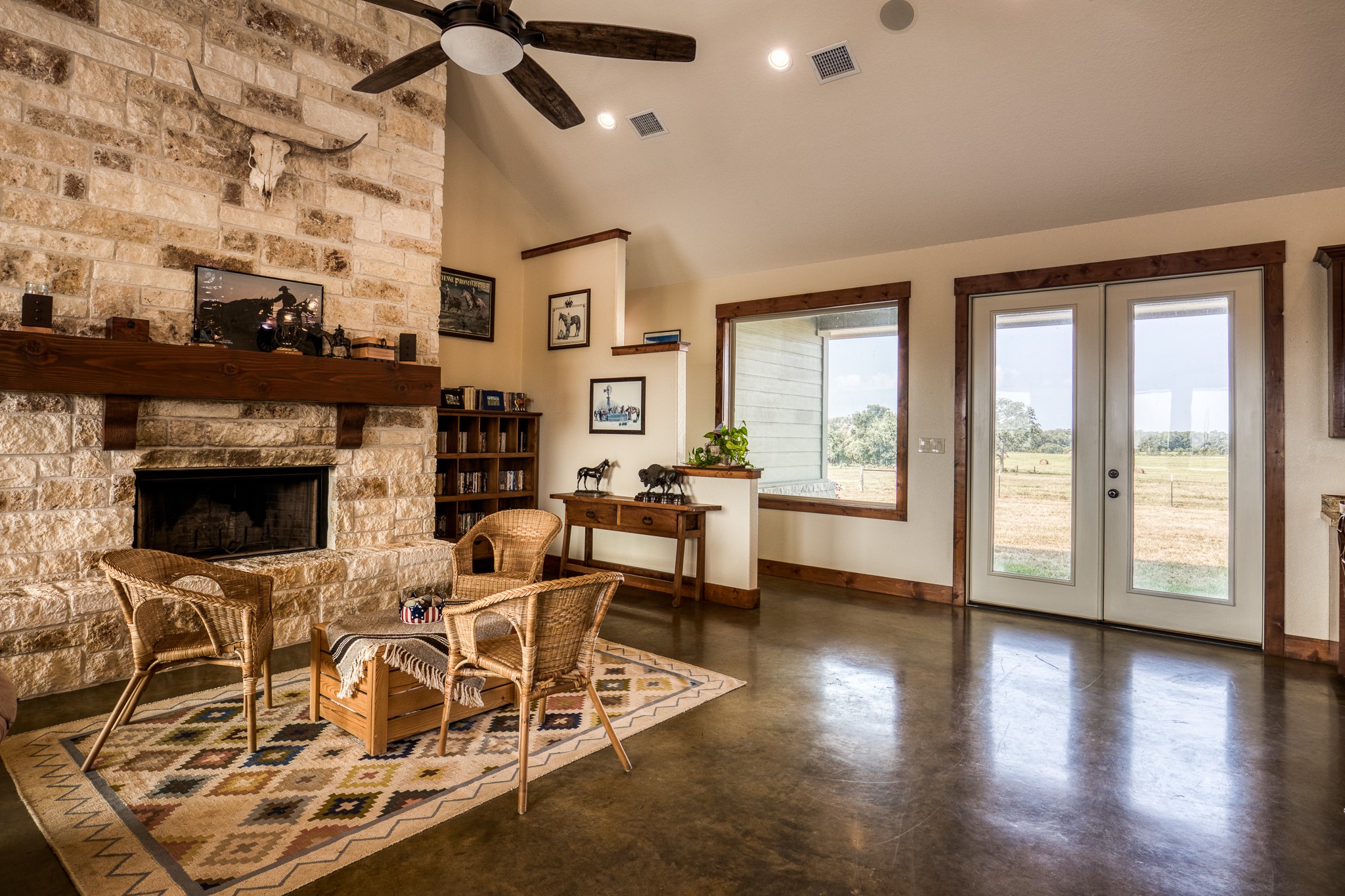 8201 Lone Star Road Washington, TX 77880 - Photo 10 of 22 a view of a livingroom with furniture a fireplace and wooden floor