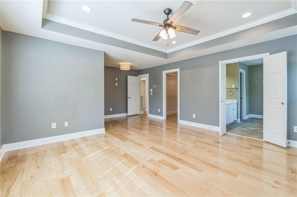 242 16th Street Northwest, Unit 14 Atlanta, GA 30363 - Photo 20 of 32 a view of an empty room and chandelier fan
