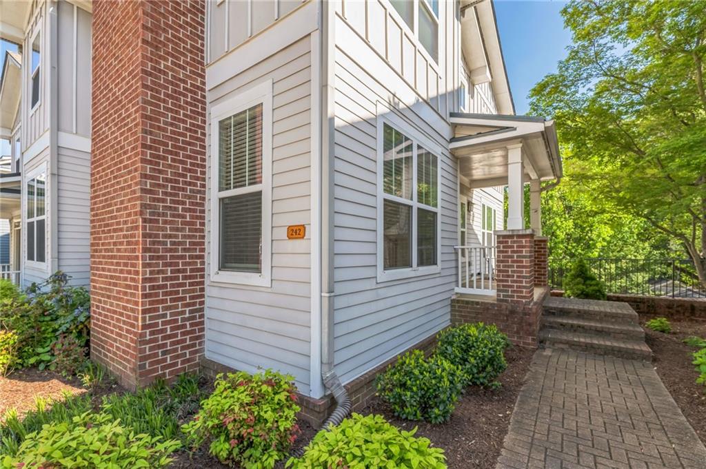 242 16th Street Northwest, Unit 14 Atlanta, GA 30363 - Photo 2 of 32 a view of a house with a yard