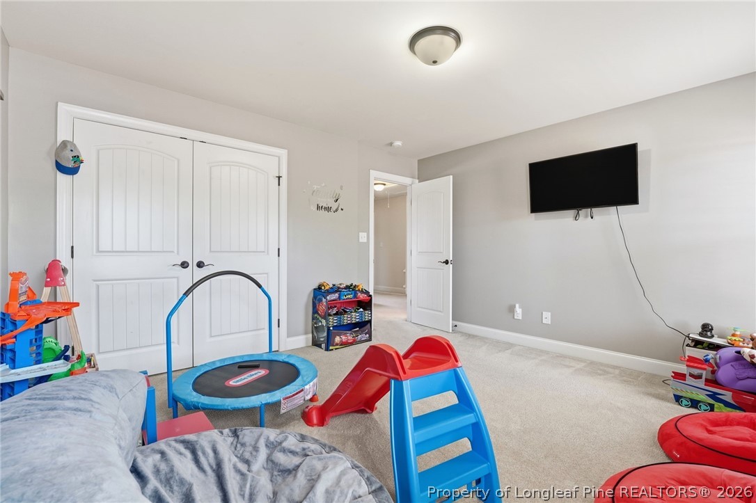 886 Micahs Way North Spring Lake, NC 28390 - Photo 29 of 50 a living room with furniture and a flat screen tv