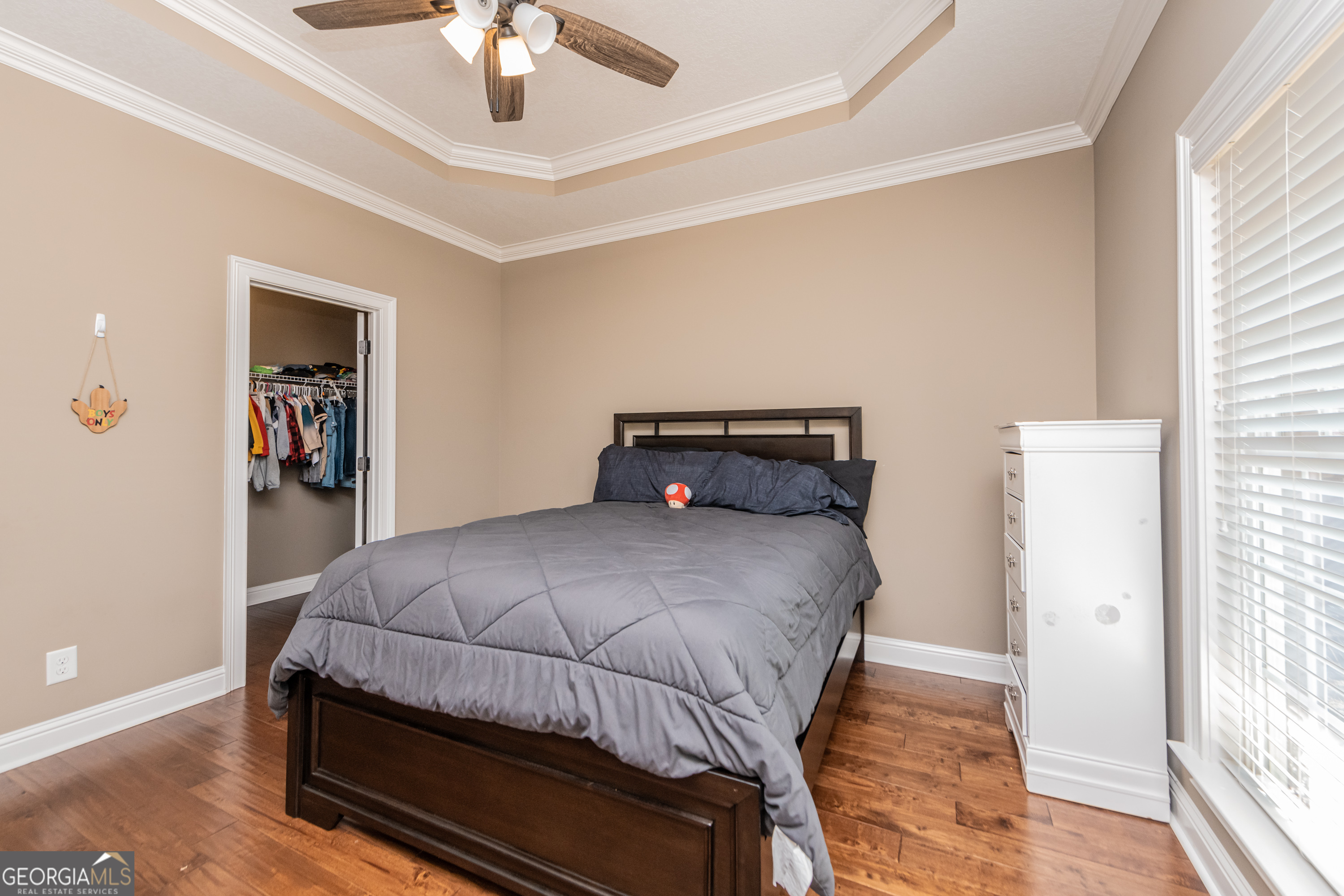 405 Old Bridge Road Warner Robins, GA 31088 - Photo 30 of 55 a bedroom with a bed and a chandelier